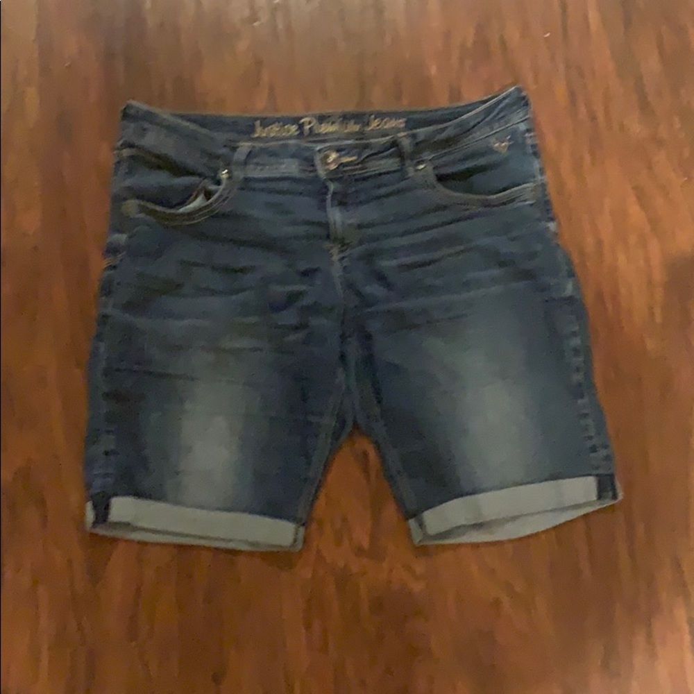A pair of jean shorts from justice .